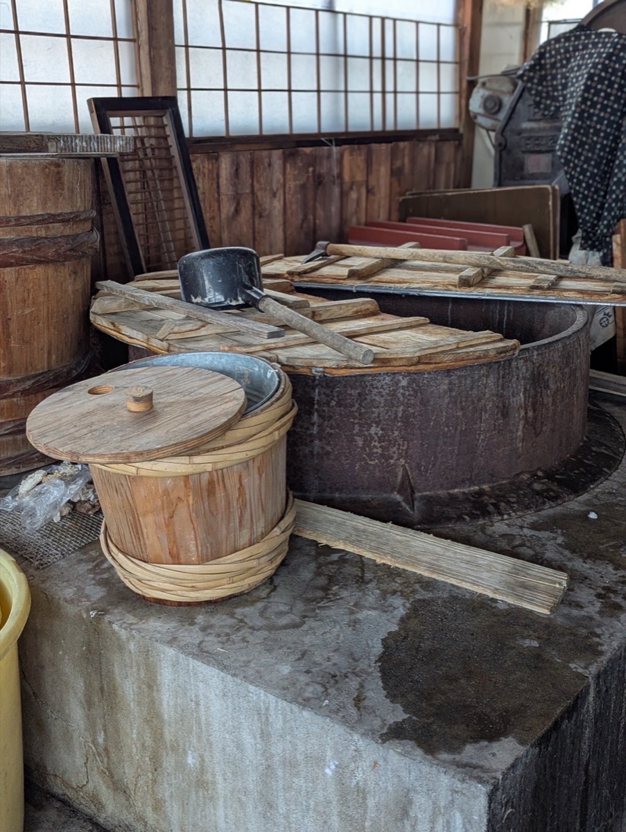 Wooden buckets and iron cauldron used for boiling mulberry bark in the Matsuzaki workshop
